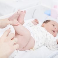 Changing the diaper of a newborn